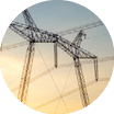 High voltage pylons with electric power lines transfering electricity from solar photovoltaic sells at sunrise. Production of sustainable energy concept.